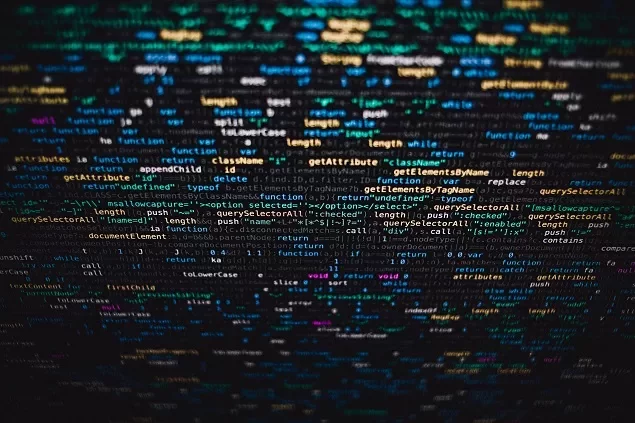 Tela de computador com código colorido em fundo escuro.